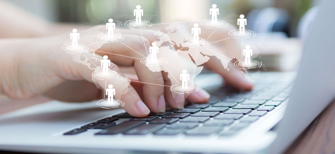 Closeup of business woman hand typing on laptop keyboard